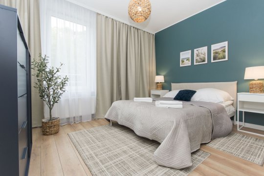 Sypialnia z łóżkiem małżeńskim - Słoneczne Tarasy I - kompleks idealny dla rodzin