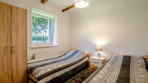 sypialnia w apartamencie kameralnym